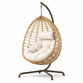 Poltrona sospesa in rattan con cuscino e struttura in metallo